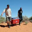 2 men holding best American made cooler taiga cooler red white blue