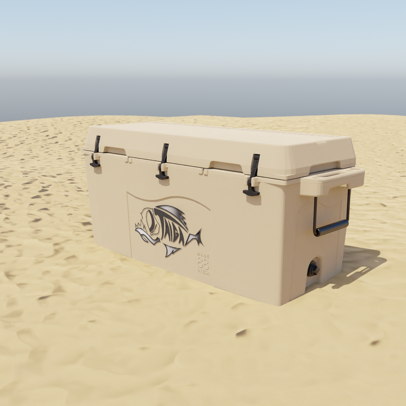 Taiga 55 quart tan cooler on beach sand