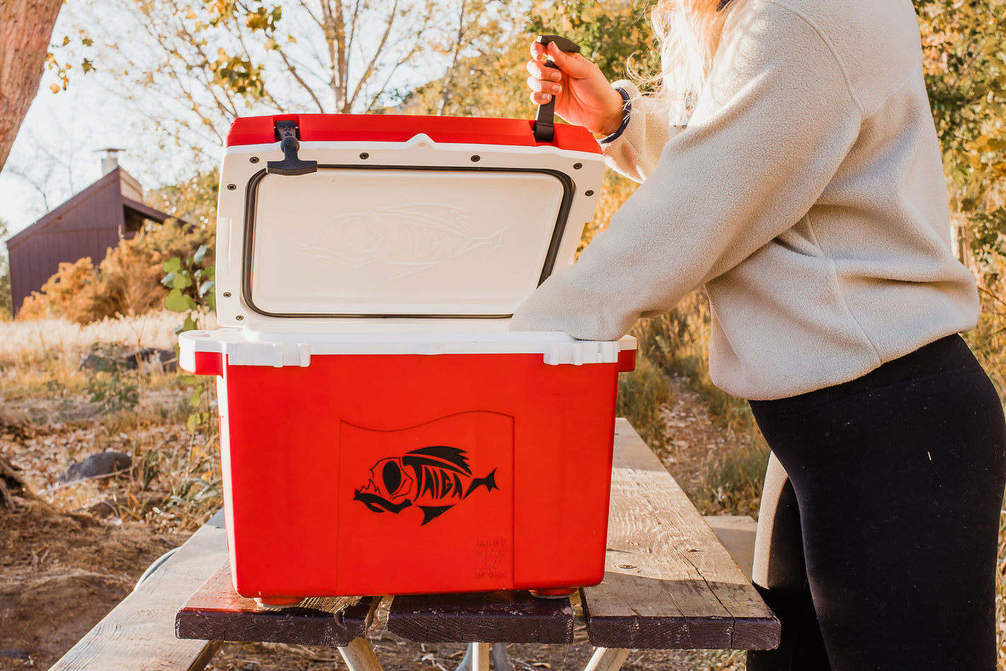 Taiga red 27 quart cooler in state park